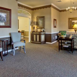 A cozy living room interior with elegant furniture and decor.