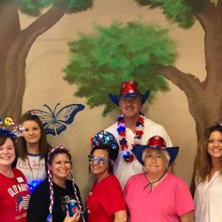 A joyful gathering celebrating with festive outfits and decorations.