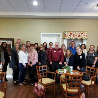 A warm gathering of friends and colleagues enjoying their time together.