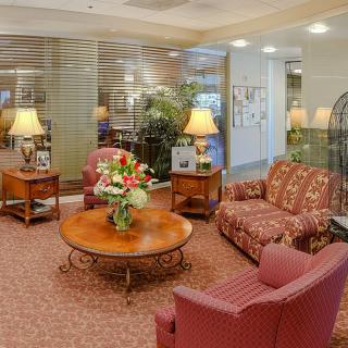 A cozy lobby with comfortable seating and warm lighting.