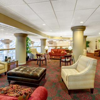 A spacious hotel lobby with comfortable seating and elegant decor.