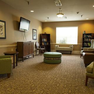 A cozy living room with comfortable seating and a television.