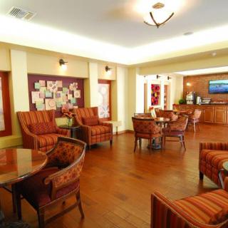 A welcoming lounge area with comfortable seating and warm lighting.