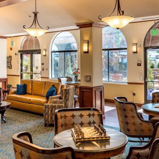 A cozy lobby with comfortable seating and warm lighting.