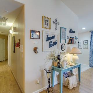 A cozy hallway adorned with wall art and a console table, showcasing personalized home decor.