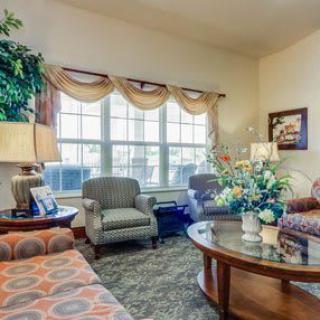 A cozy living room with comfortable seating and elegant decor.