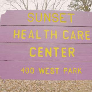 Sign for Sunset Health Care Center located at 400 West Park.