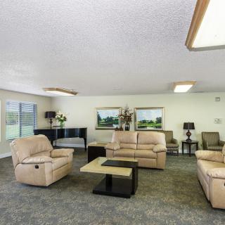 A spacious living room with comfortable sofas, coffee table, and modern decor.