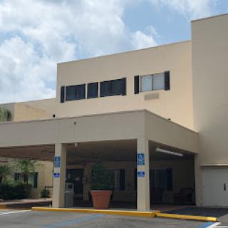 A view of a healthcare facility showcasing its entrance and architectural design.