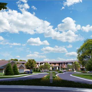 A picturesque view of suburban homes with manicured lawns and a cloudy blue sky.