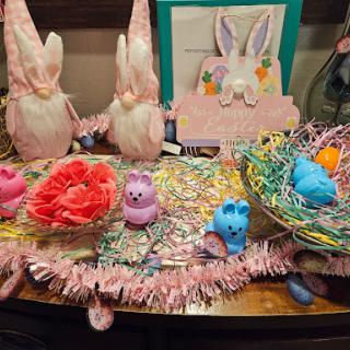 A festive Easter display featuring adorable bunnies, colorful decorations, and playful candy.