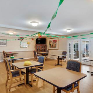A decorated dining area with tables and chairs.