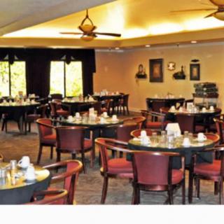 A cozy restaurant dining area with neatly arranged tables and chairs.