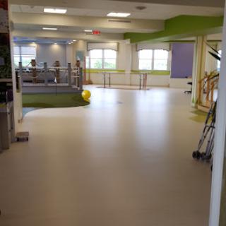 A spacious and bright interior featuring modern design elements, perfect for activities and collaboration.