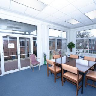 A bright and spacious meeting room with a large table and ample seating, perfect for team discussions.