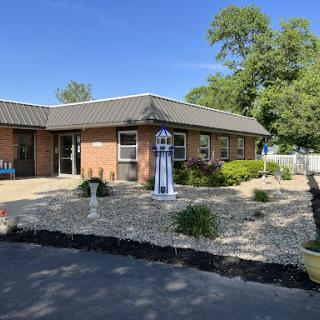 A well-maintained residential building with a landscaped garden.