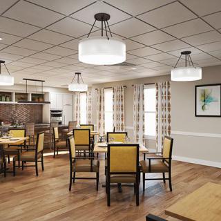 A modern dining area with elegant furnishings and ambient lighting.