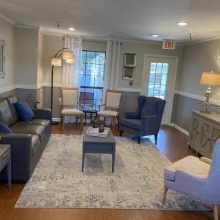 A neatly arranged living room with comfortable seating and stylish decor.