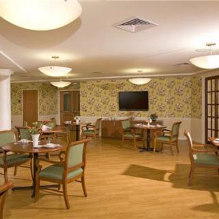 A cozy dining area with elegant furniture and warm lighting.