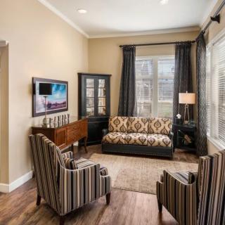 A cozy living room with modern decor and comfortable seating.