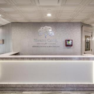 A modern reception desk in a lobby with elegant interior design.