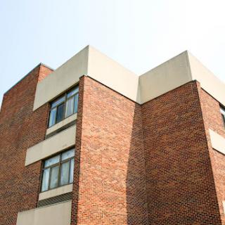 A modern brick building showcasing contemporary architectural design.