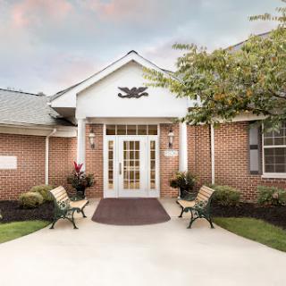 Welcoming entrance of a charming brick building.