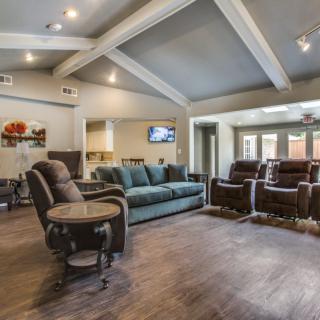 A spacious living room with comfortable seating and modern interior design.