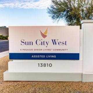 Sign for Sun City West, an assisted living community.