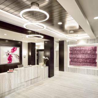 A modern lobby featuring stylish lighting and contemporary artwork.