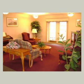 A cozy living room with comfortable seating and warm lighting.