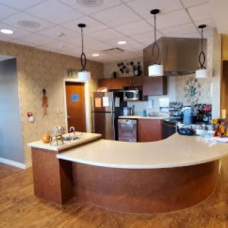 A modern kitchen featuring stylish appliances and a well-designed countertop.