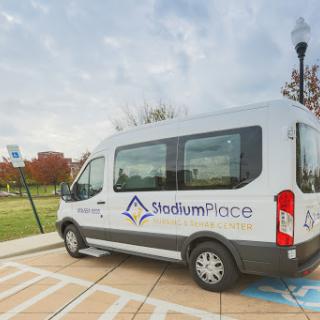A ShuttlefromPlace van parked in an outdoor area, ready to provide transportation services.