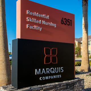 Signage for a residential skilled nursing facility operated by Marquis Companies, indicating the address.