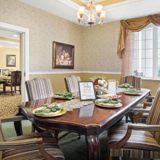 Elegant dining room with a beautifully set table and classic decor.