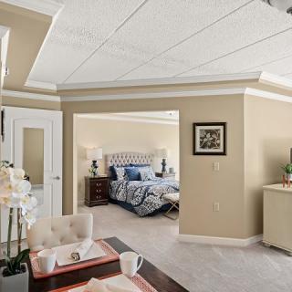 A modern and luxurious bedroom with stylish decor and comfortable furnishings.