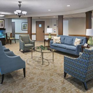 A cozy living room with comfortable seating and elegant decor.