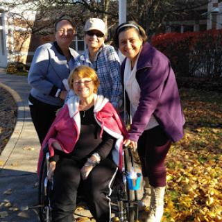 A joyful moment shared among friends and family during a sunny autumn day.