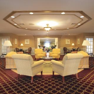 A luxurious hotel lobby with comfortable seating and elegant decor.