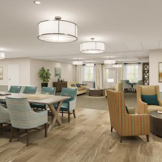 A spacious and inviting common area featuring modern furniture and warm lighting.