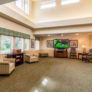 Spacious living room with comfortable seating and a large television.