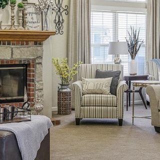 Cozy living room with a fireplace and elegant decor.