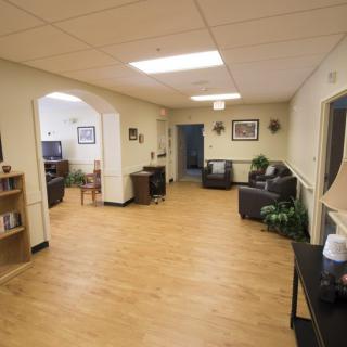 A spacious lobby with comfortable seating and a warm, welcoming atmosphere.