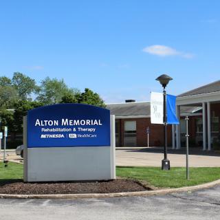 Alton Memorial Hospital sign indicating the facility's presence and services.