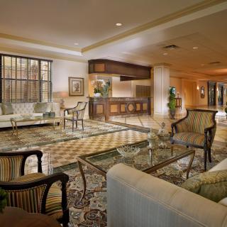 A luxurious hotel lobby with elegant seating and a welcoming reception desk.
