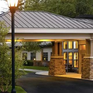 Illuminated entrance of a building during evening hours.
