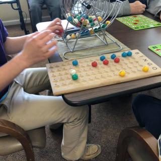 People playing bingo indoors at a table.