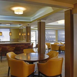A modern restaurant interior with comfortable seating and ambient lighting.