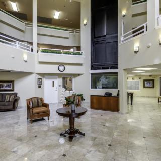 A modern and spacious lobby area with elegant furniture and contemporary design.
