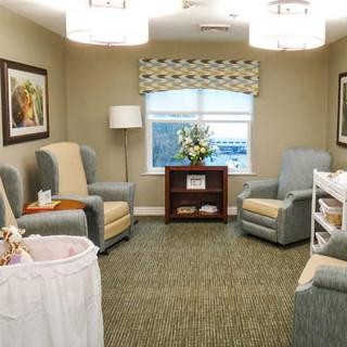 A cozy living room with armchairs and elegant decor.